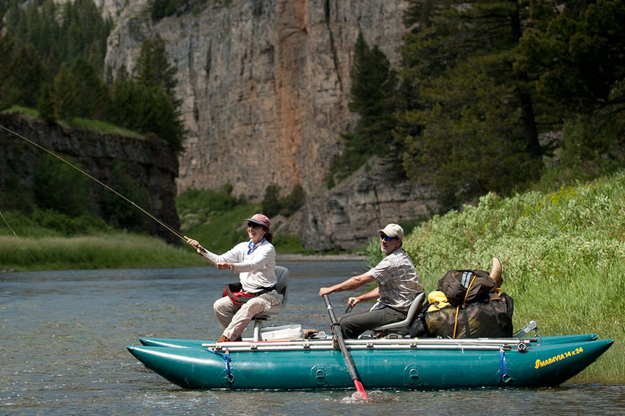 couple on inflatable raft fishing on the smith river in montana state parks
