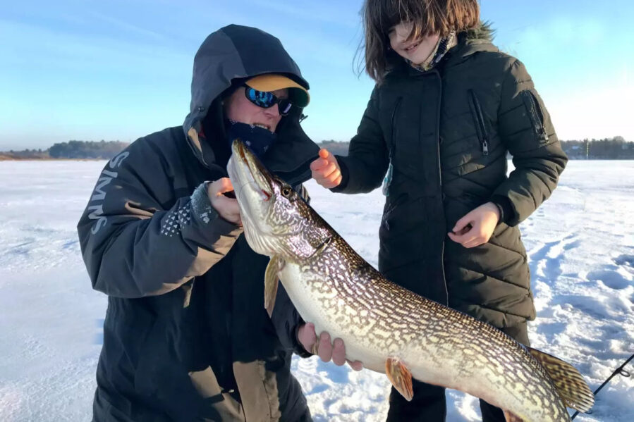Woman and girl caught northern pike in lake