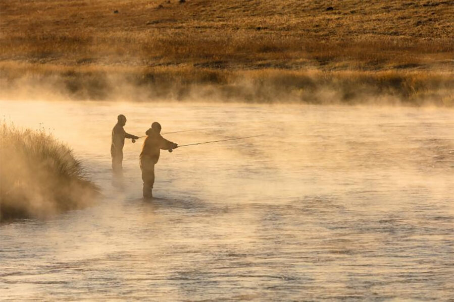 two men fall fishing on the madison river in yellowstone national park